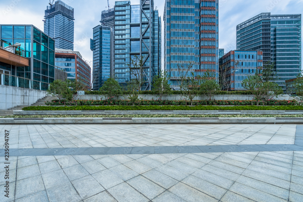 Fototapeta premium empty pavement and modern buildings in city.