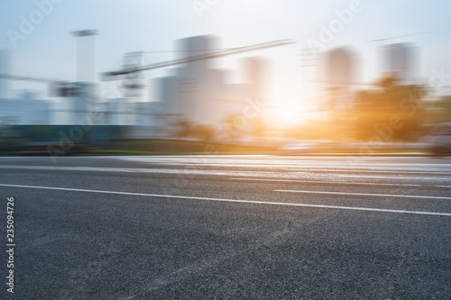 Empty urban road and modern skyline.