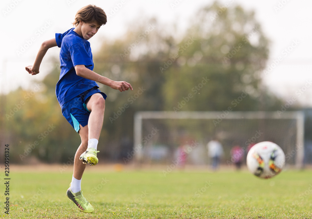 Young children player on the football match