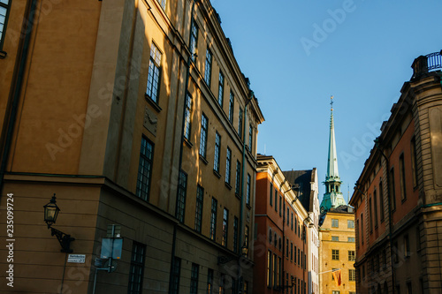 The German Church in Swedish Tyska kyrkan in narrow alley between old houses in Gamla stan, the old town of Stockholm, Sweden.