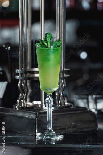 Green refreshing Alcoholic Cocktail. Mint on top