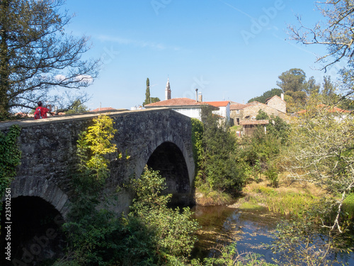 Medieval stone bridge Ponte Velha over the Furelos River - Furelos photo