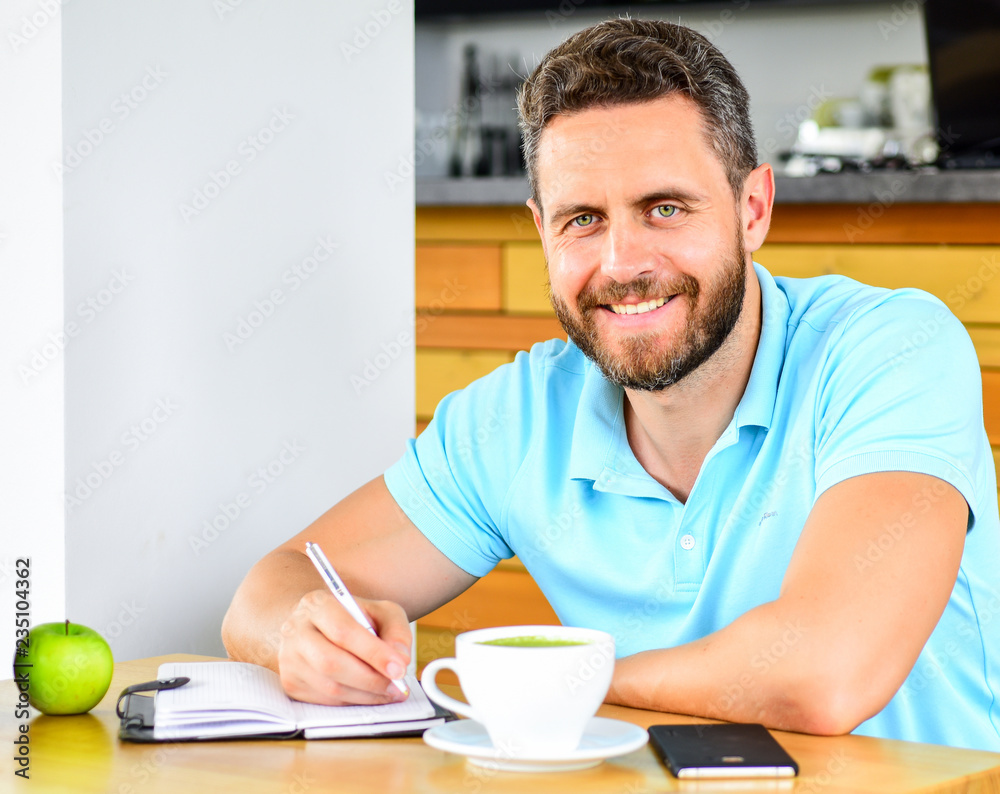 Man sit eat green apple fruit. Coffee and fruit recharge energy reserve. Healthy habits. Healthy man care vitamin nutrition during working day. Healthy snack. Physical and mental wellbeing concept Man sit eat green apple fruit. Coffee and fruit recharge energy reserve. Healthy habits. Healthy man care vitamin nutrition during working day. Healthy snack. Physical and mental wellbeing concept