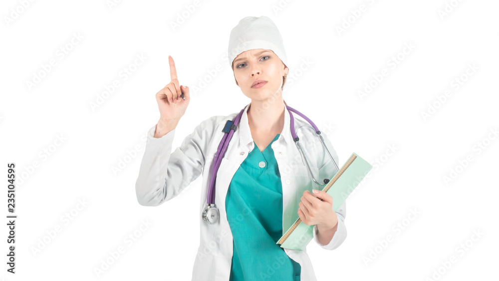 serious doctor in white uniform with stethoscope, with notebook in hand keeps her finger up. Attention sign serious doctor in white uniform with stethoscope, with notebook in hand keeps her finger up. Attention sign