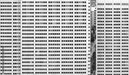 Deatail of Tokyo modern architecture , buildings facade with windows and street life across space between the skyscrapers   .