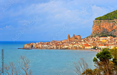 Cefalu, Sicily. Aerial view and panorama of sicilian coastal medieval small city Cefalu with torquoise sea and blue sky. Province of Palermo, Italy.