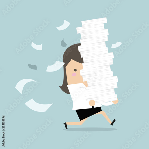 Businesswoman run holding a lot of papers in her hands.