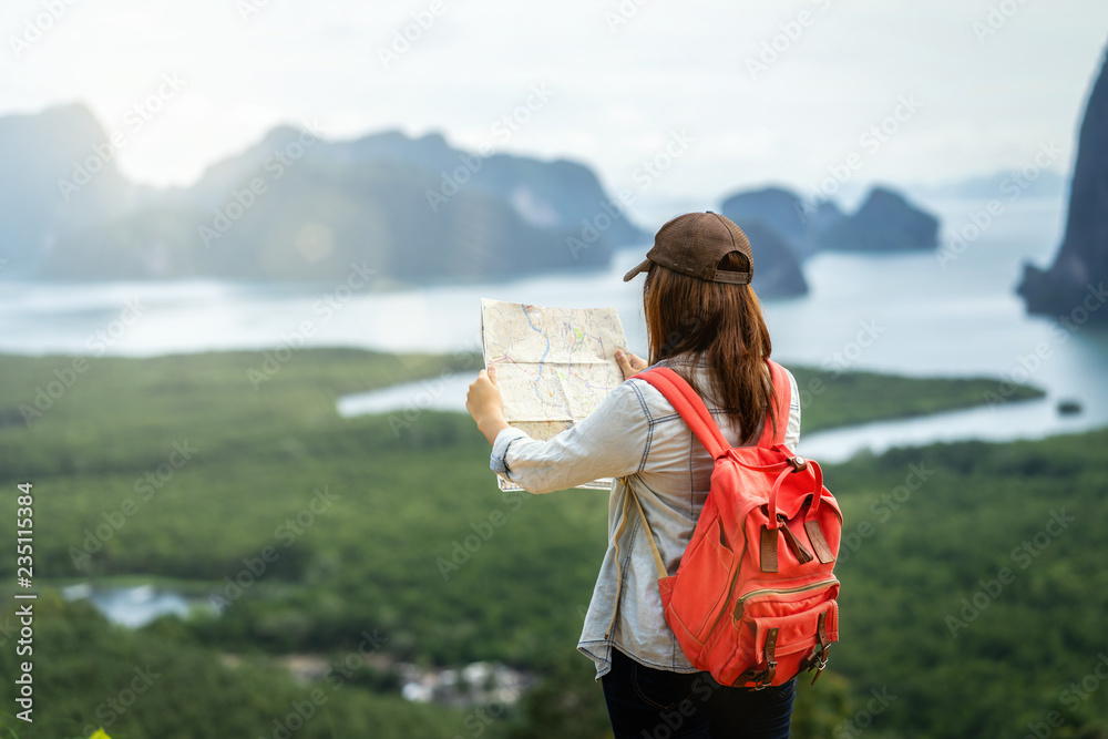 Back side of Asian woman traveler looking the map for travel with backpacker at Fantastic Landscape of samed nang chee view point, travel and holiday concept - obrazy, fototapety, plakaty 
