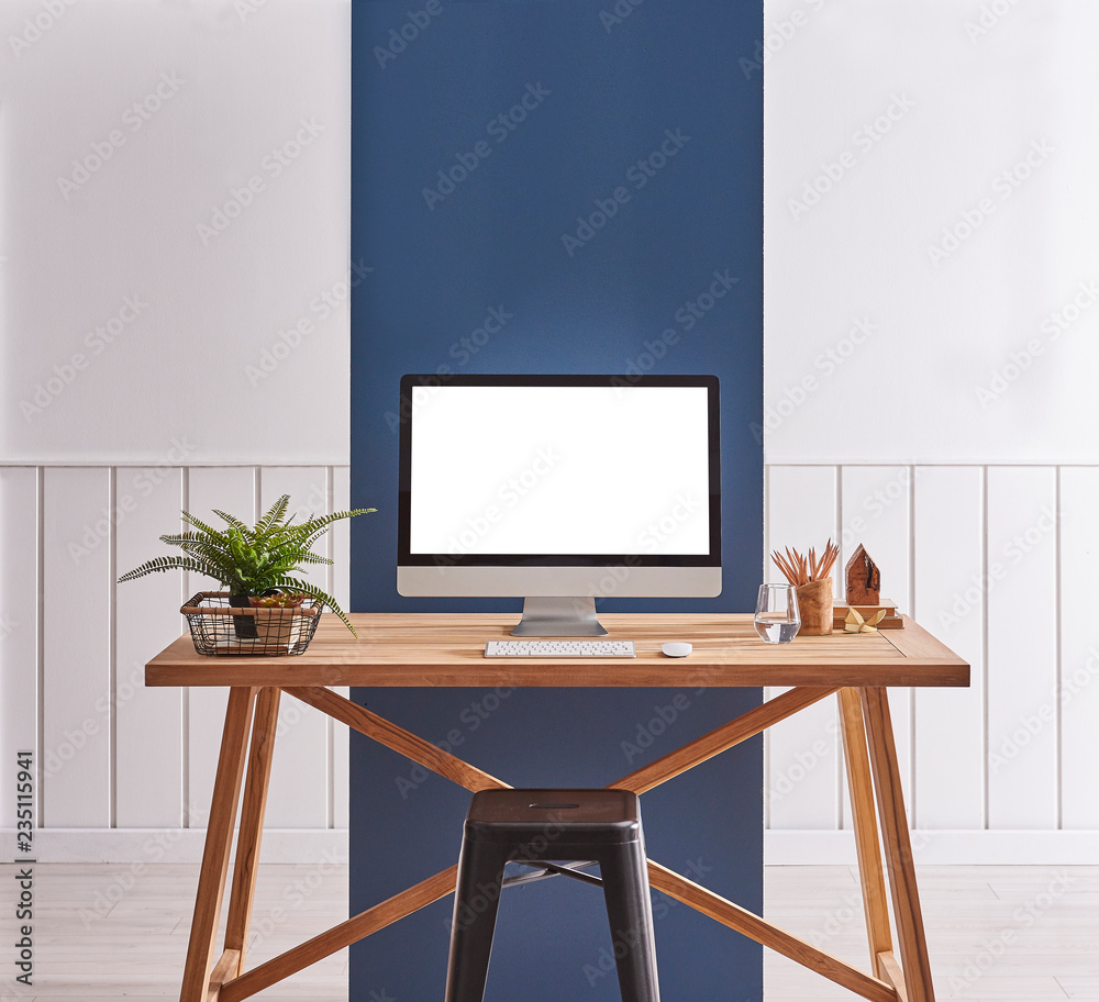 Close up desktop on the wooden table. White and blue background and black chair. Close up desktop on the wooden table. White and blue background and black chair.