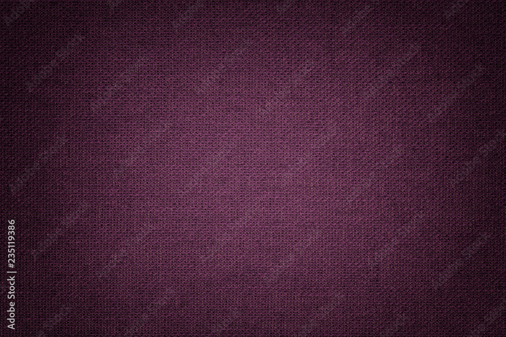 Fototapeta premium Dark purple background from a textile material with wicker pattern, closeup.