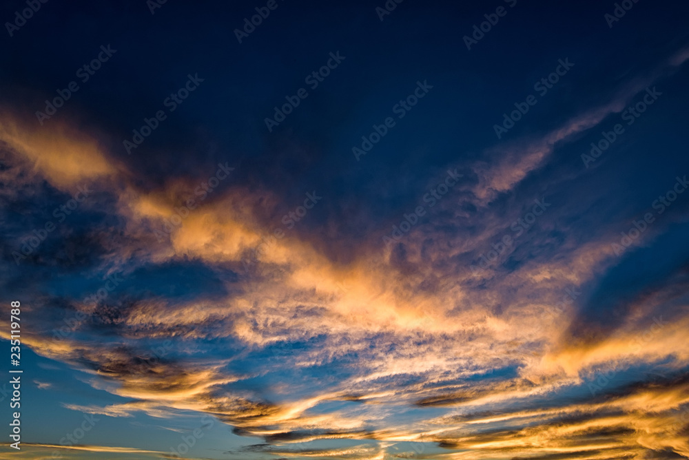 Dramatic blue sunset sky with pink clouds