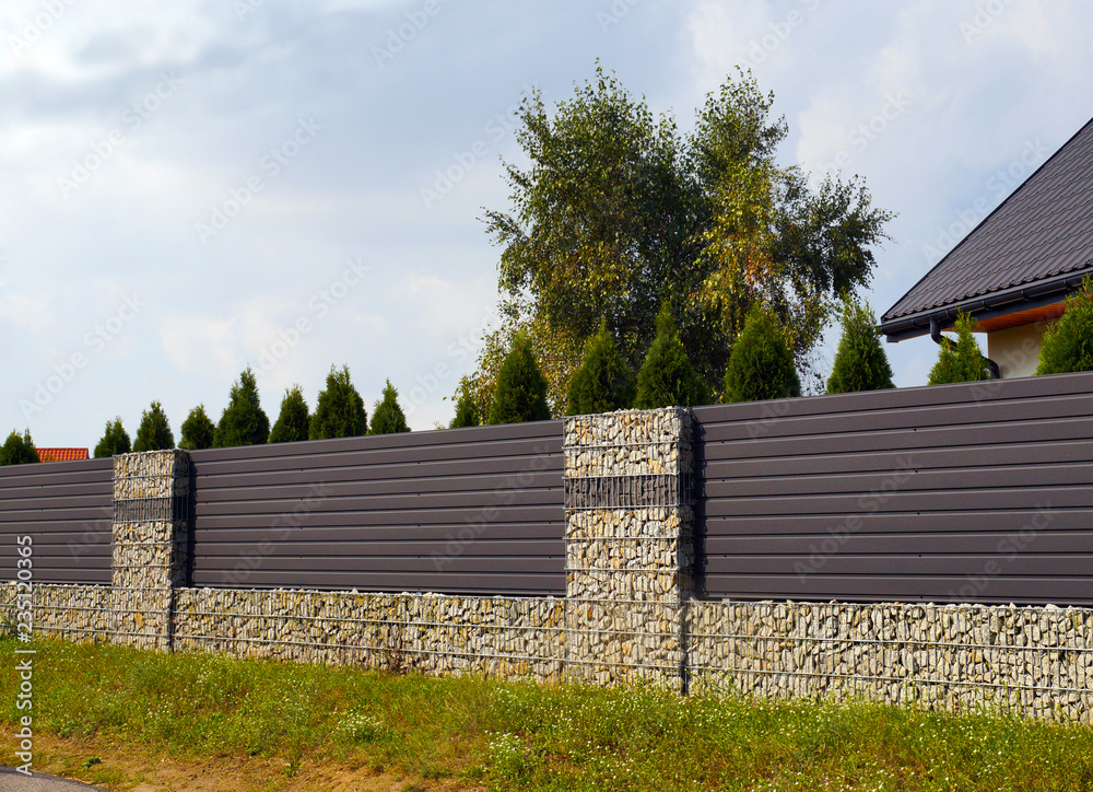 Around the house. An effective way of arranging the home surroundings with the help of a gabion fence.