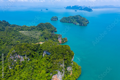 Aerial drone view of beautiful lush green tropical islands with remote, empty bays and beaches