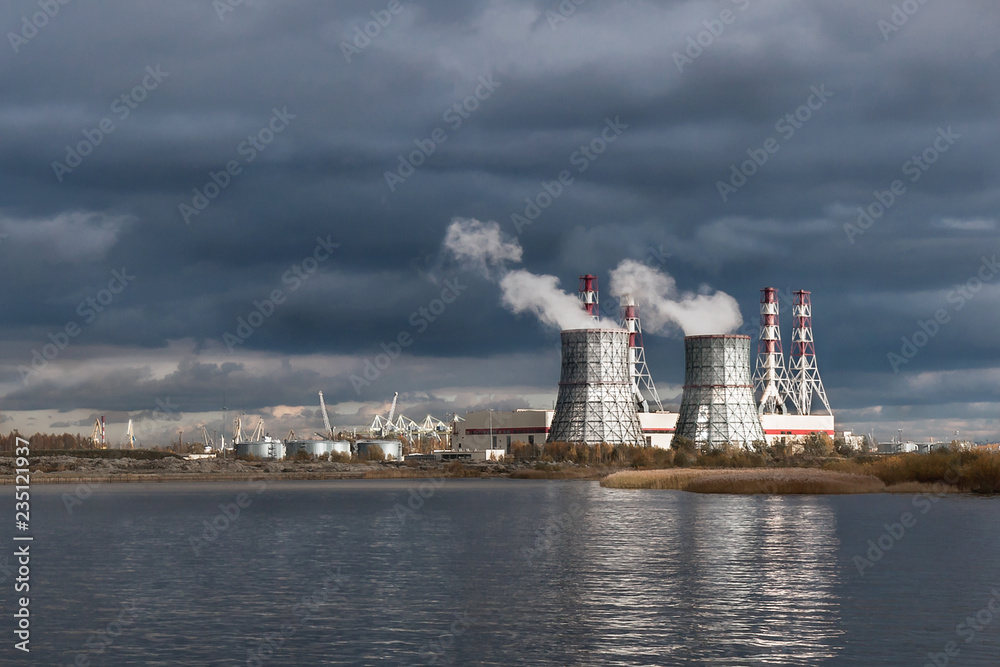  thermal power plant on the Baltic sea against the dramatic sky