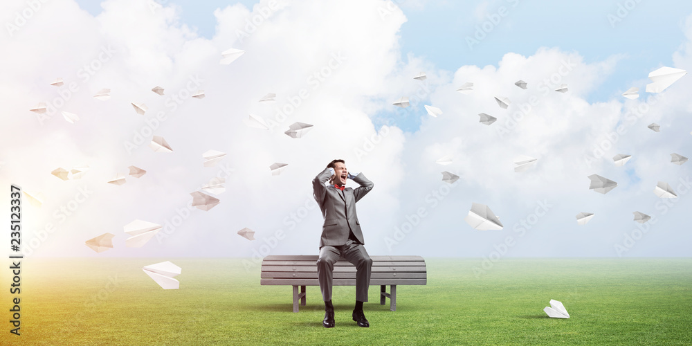 Young man in suit in park dont want to hear anything Young man in suit in park dont want to hear anything