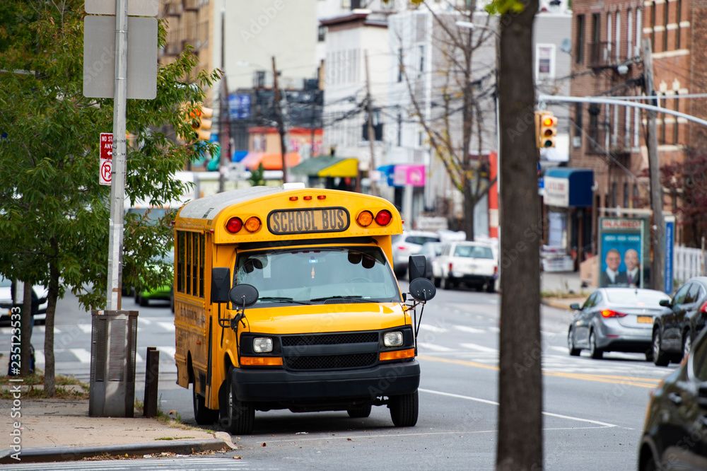 A school bus on the streets of the Bronx, New York city, USA. The Bronx is the northernmost of the five boroughs of New York City, in the U.S. state of New York.