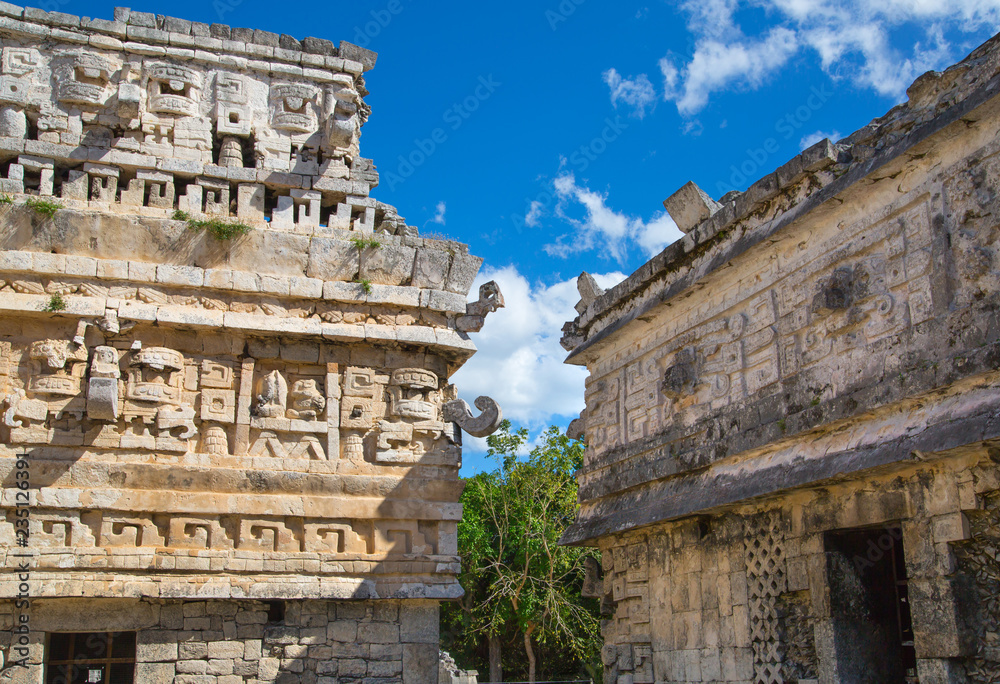 Mexico, Yucatán - February 15, 2018: Mexico, Chichen Itza. Detail of decorative band of temple. Ruins of the private yard, possibly belonged to the royal family Mexico, Yucatán - February 15, 2018: Mexico, Chichen Itza. Detail of decorative band of temple. Ruins of the private yard, possibly belonged to the royal family