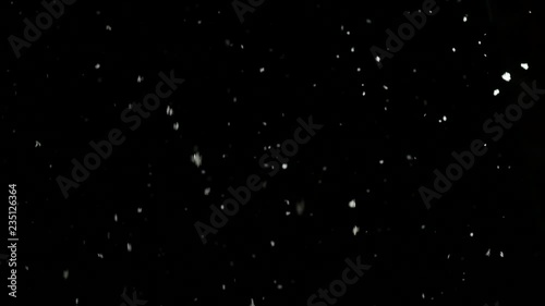 snow falls slowly in night winter. 4K