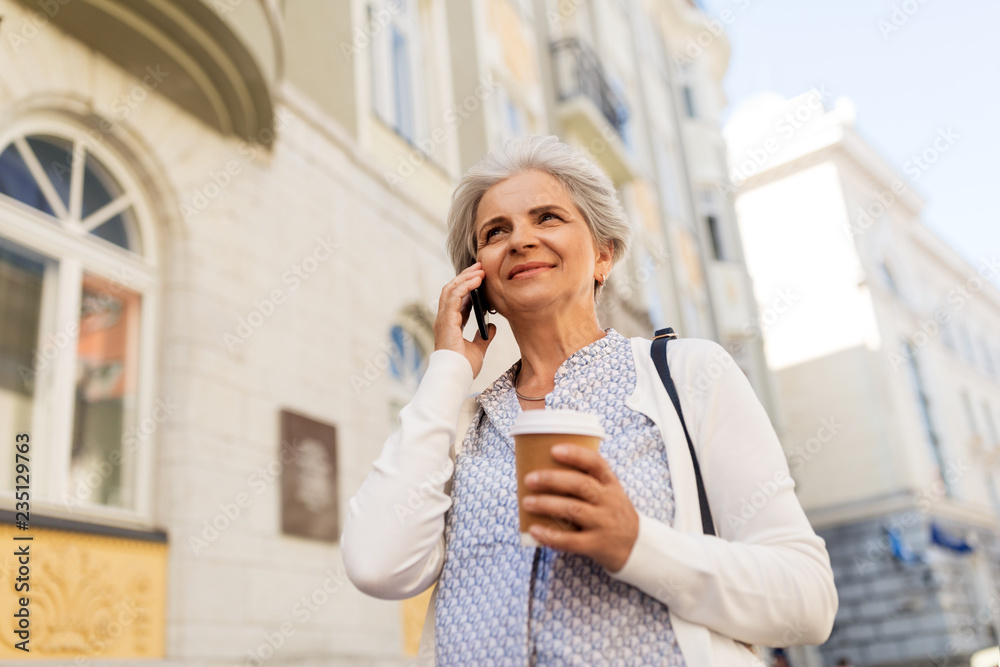 retirement, communication and old people concept - happy senior woman drinking coffee and calling on smartphone in summer city