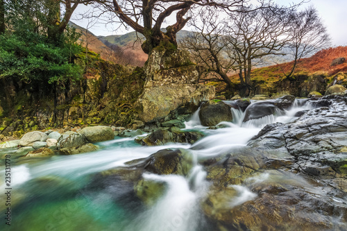 Autumnal setting at Stonethwaite Beck, Cumbria, England photo