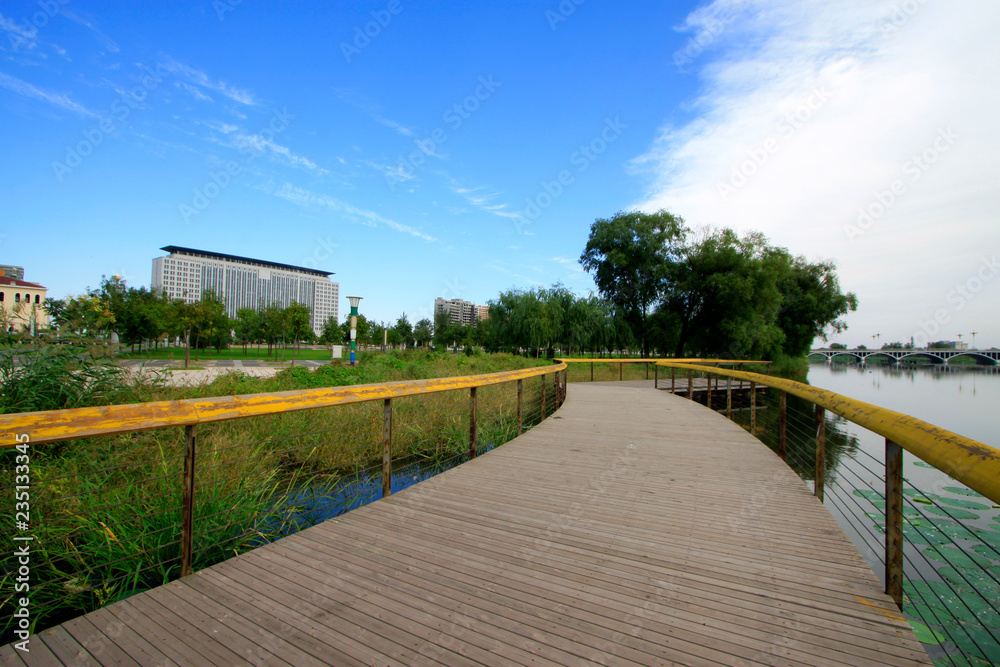 Buildings and wooden trestle in a park