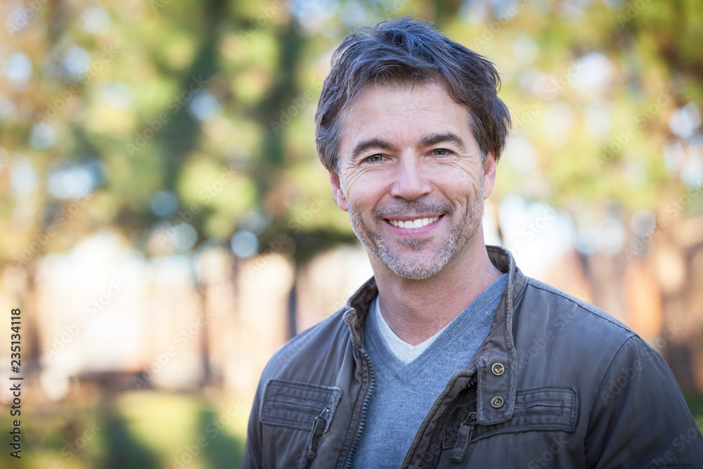 Portrait Of A Mature Man Smiling At The Park Portrait Of A Mature Man Smiling At The Park