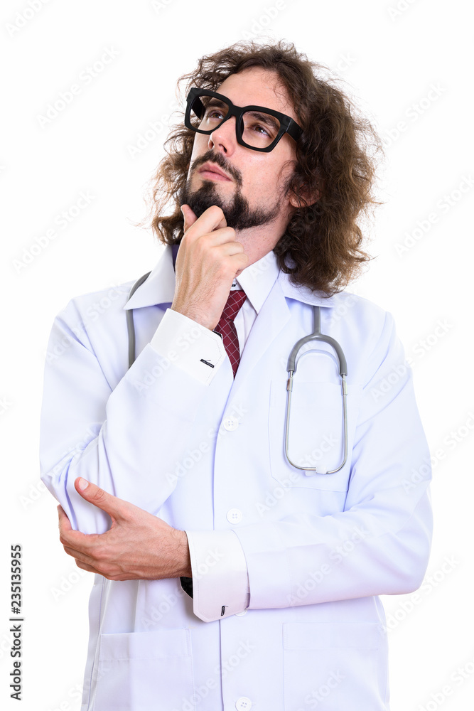 Studio shot of handsome man doctor thinking while looking up Studio shot of handsome man doctor thinking while looking up