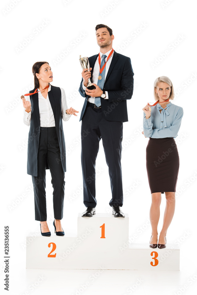 businesspeople holding awards while standing on winners podium isolated on white businesspeople holding awards while standing on winners podium isolated on white