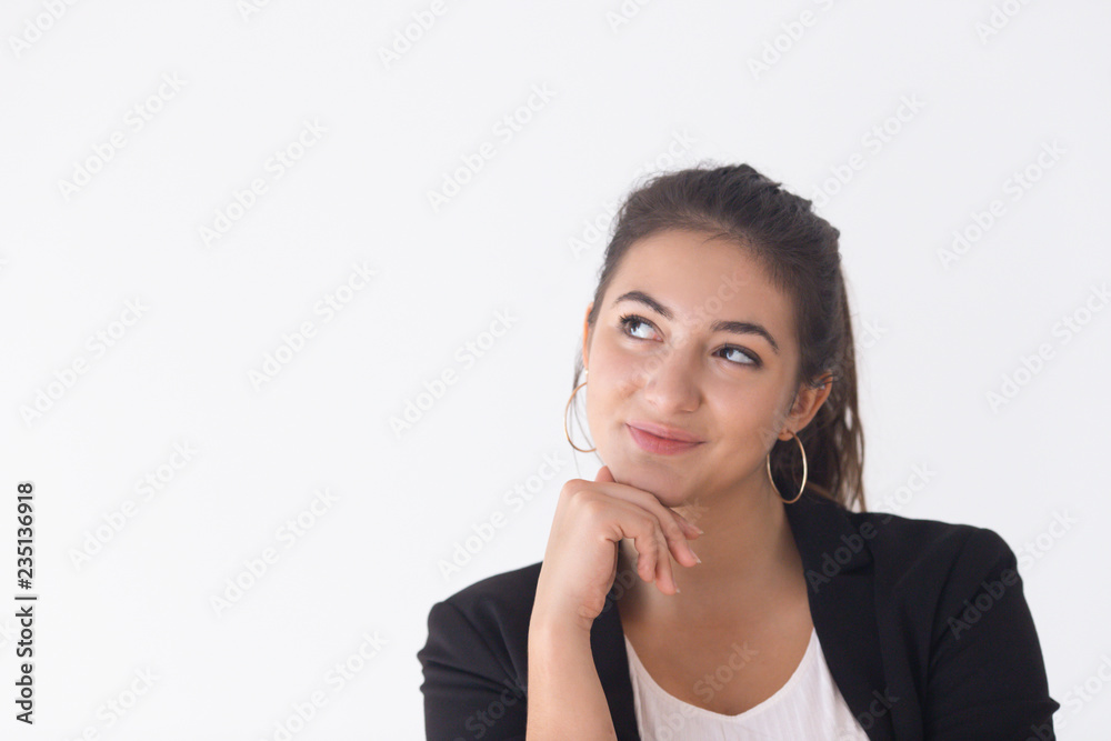 Portrait of happy Caucasian girl supporting chin and looking aside. Young female specialist having bright idea. Creative mind concept Portrait of happy Caucasian girl supporting chin and looking aside. Young female specialist having bright idea. Creative mind concept