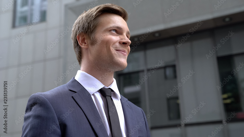 Inspired confident young male in business suit beginning new successful startup