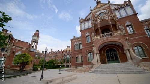 BARCELONA, SPAIN - MAY 2018: People visit Recinte Modernista de Sant Pau. The city attracts 15 million tourists annually photo