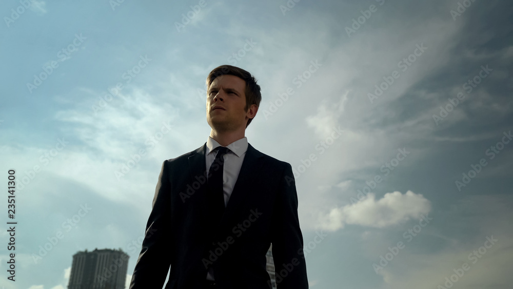 Handsome young businessman walking outdoor success and self-confidence concept