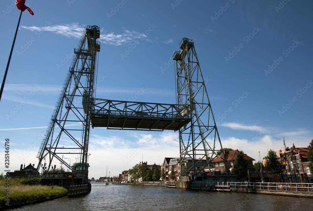 Steel vertical lift bridge in Alphen aan den Rijn over the canal Gouwe
