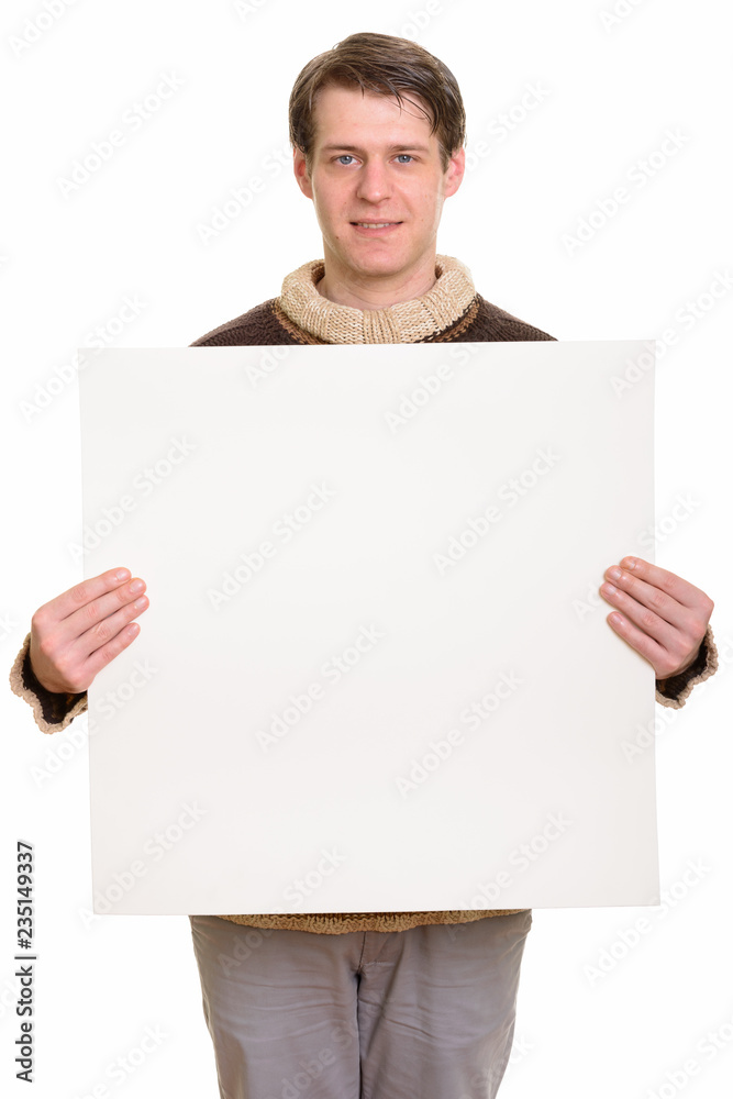 Portrait of happy handsome Caucasian man holding copyspace Portrait of happy handsome Caucasian man holding copyspace