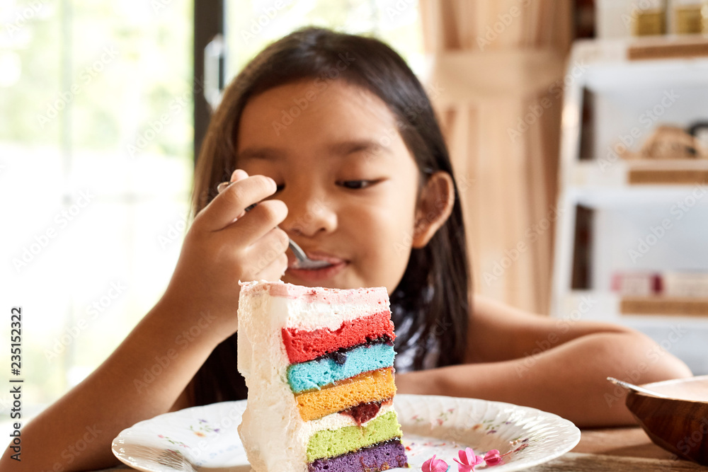 Asian girl eatting cake in cafe. Asian girl eatting cake in cafe.