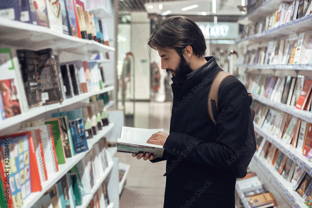 Modern man looking at his smartphone