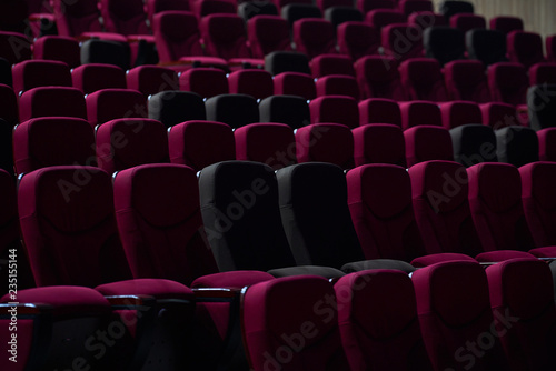 empty red chairs in theaters