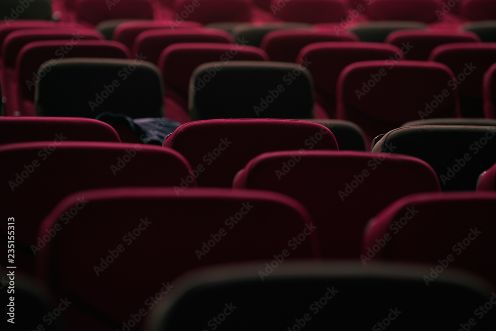 Fototapeta premium abstract red cinema seats in dark tone