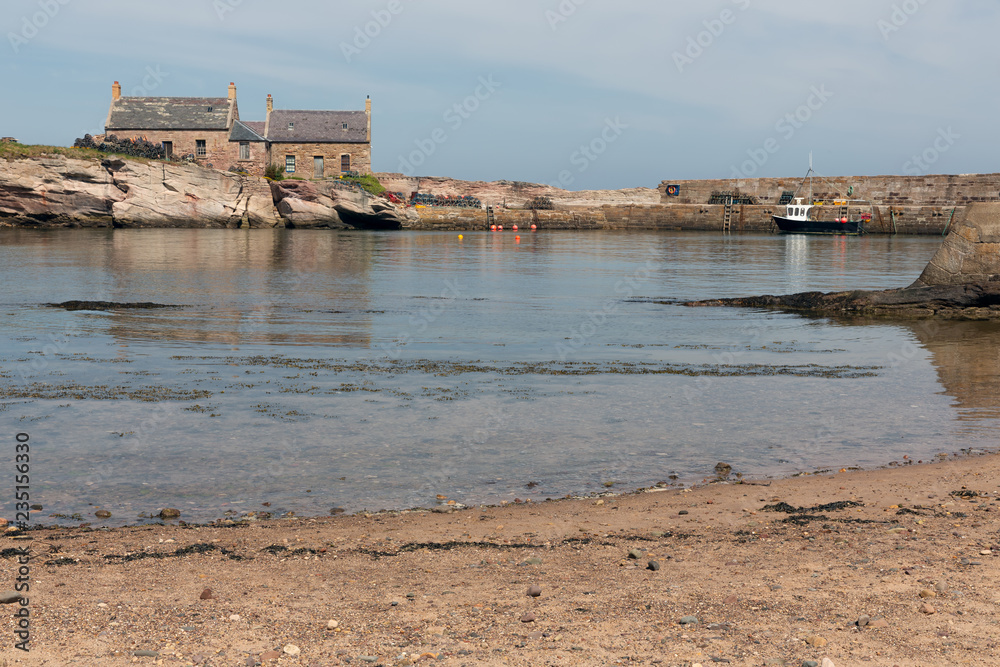 Cove harbor with fishing ship at Scottish North Sea coast Cove harbor with fishing ship at Scottish North Sea coast