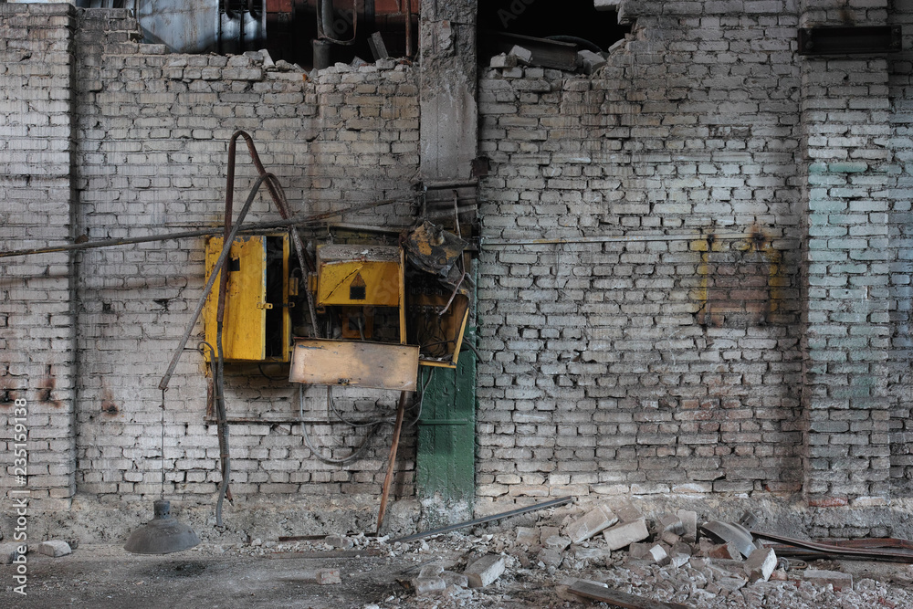 Brick wall in the old abandoned car factory. Brick wall in the old abandoned car factory.