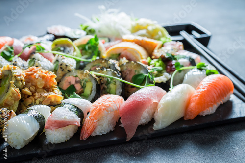 Sushi set with shrimps and rice on concrete table