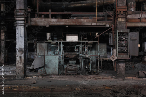 Destroyed equipment in an old abandoned car factory.