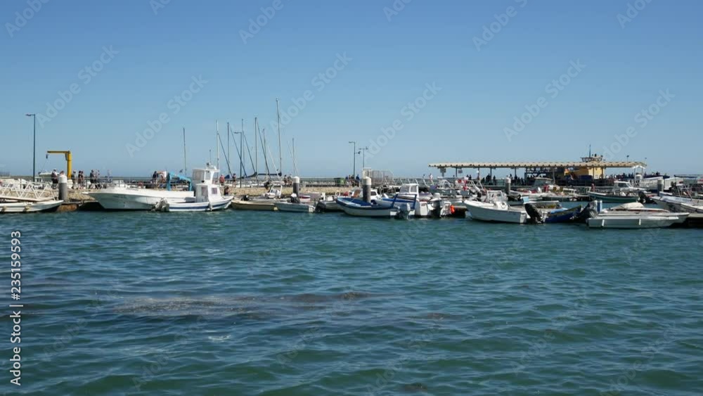 Marina / harbor in Olhao, Algarve, Portugal in summer, pan right Marina / harbor in Olhao, Algarve, Portugal in summer, pan right