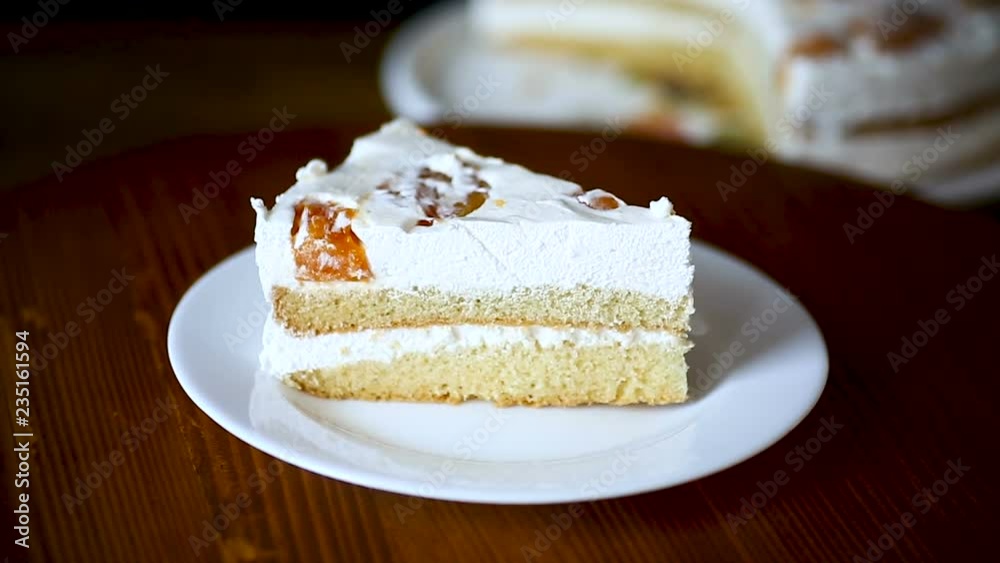 a piece of homemade sweet cake with cream and canned apricots a piece of homemade sweet cake with cream and canned apricots