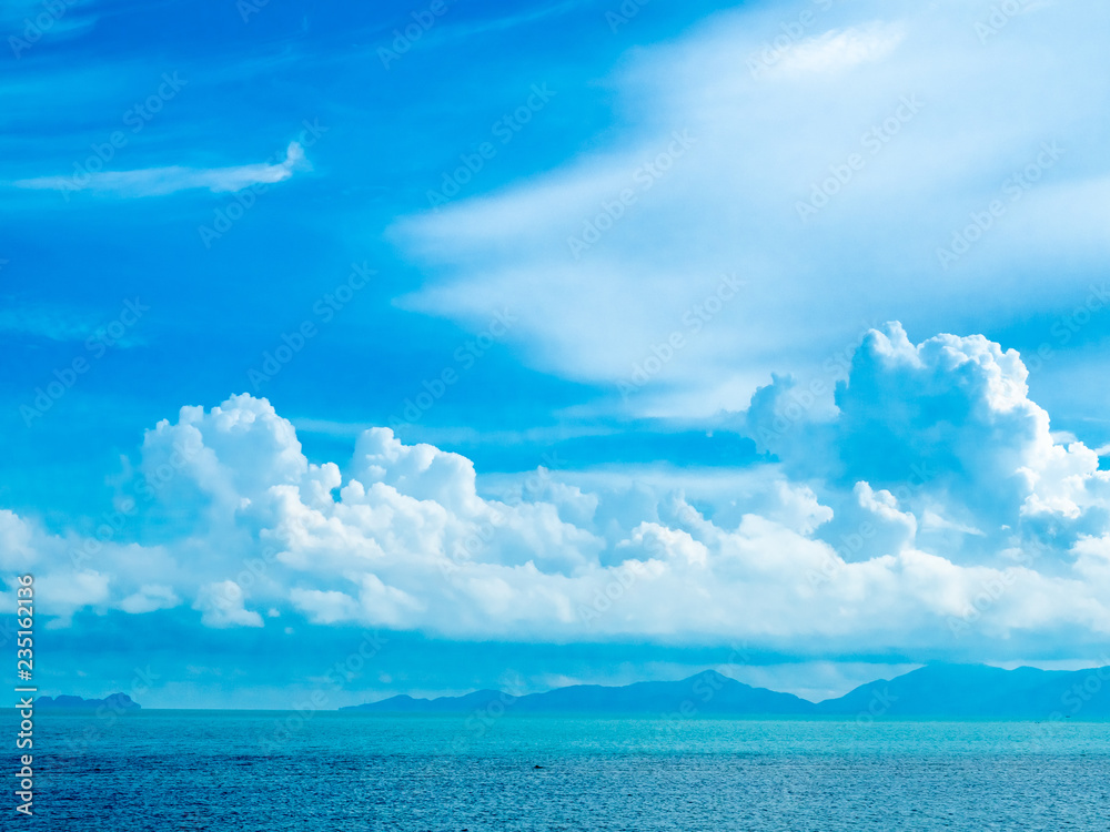 Seascape view under cloudy blue sky