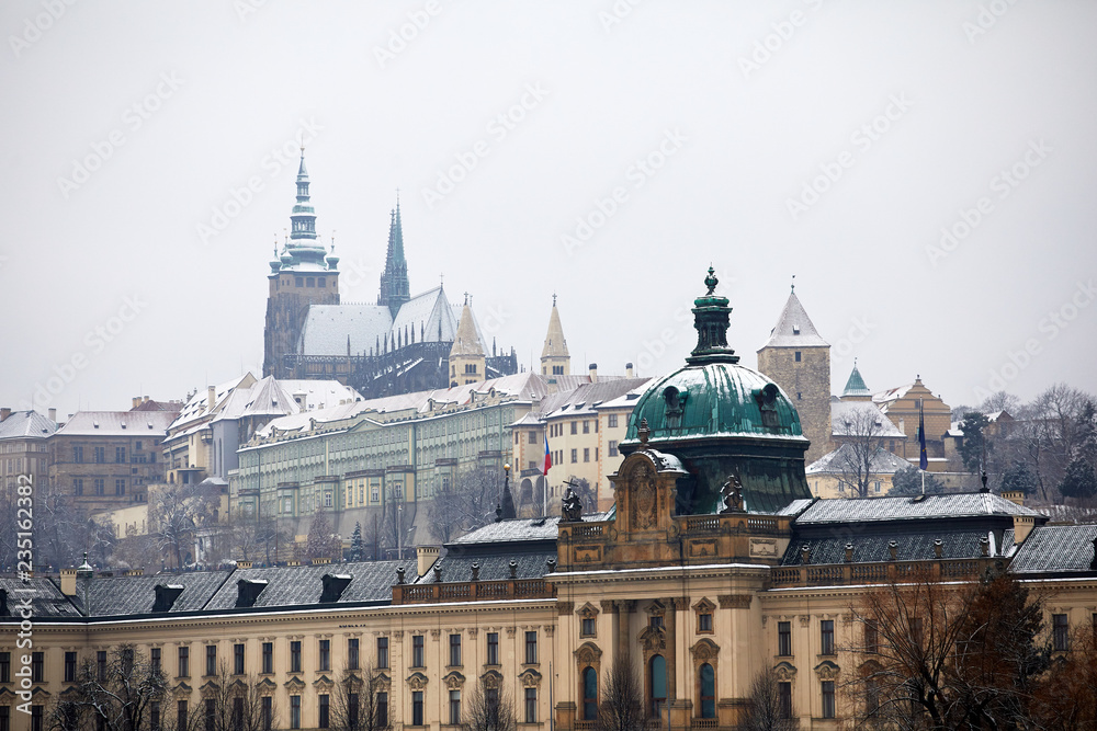 View of Prague in the winter. Prague, Czech Republic old streets in the snow. View of the historical part of Prague
