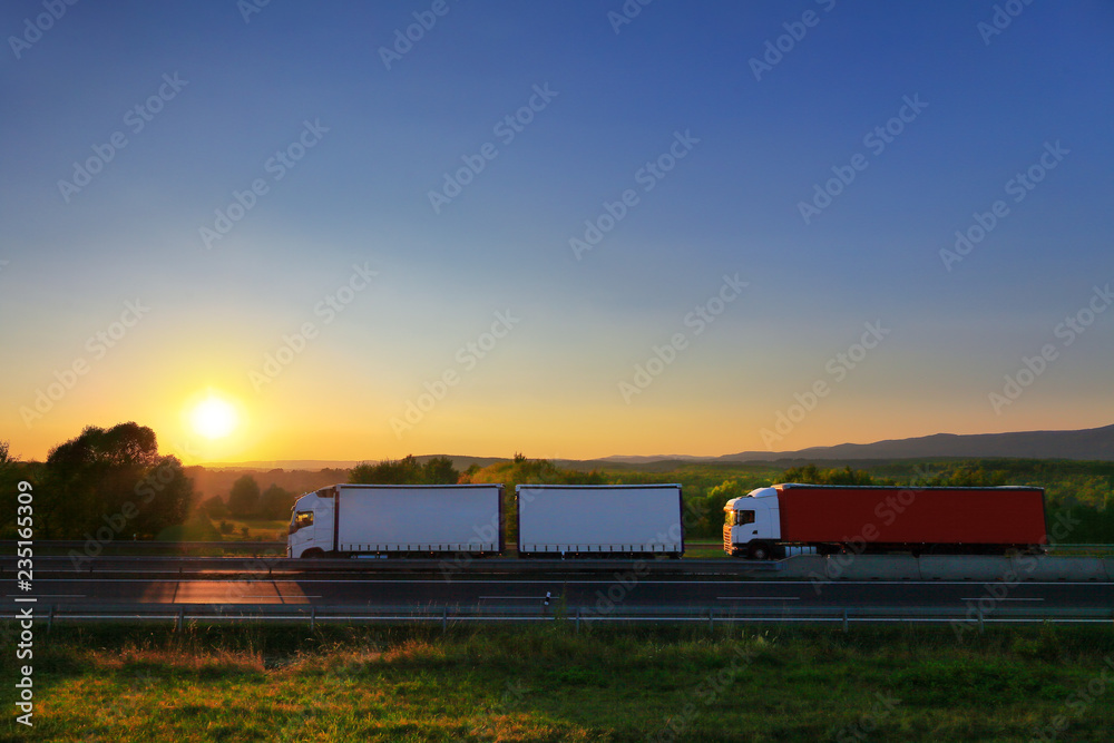 Truck transport on the road at sunset Truck transport on the road at sunset