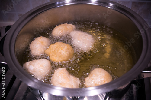 Dough Friying in a Pot during the Preparation of an Italian Christmas Traditional Dish called Pettole