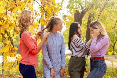 Summer autumn vacation  holidays  travel and people concept - group of young women in the park
