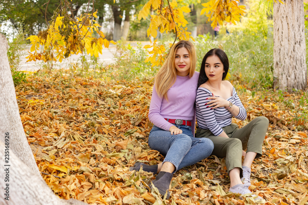 Summer autumn vacation, holidays, travel and people concept - group of young women in the park Summer autumn vacation, holidays, travel and people concept - group of young women in the park